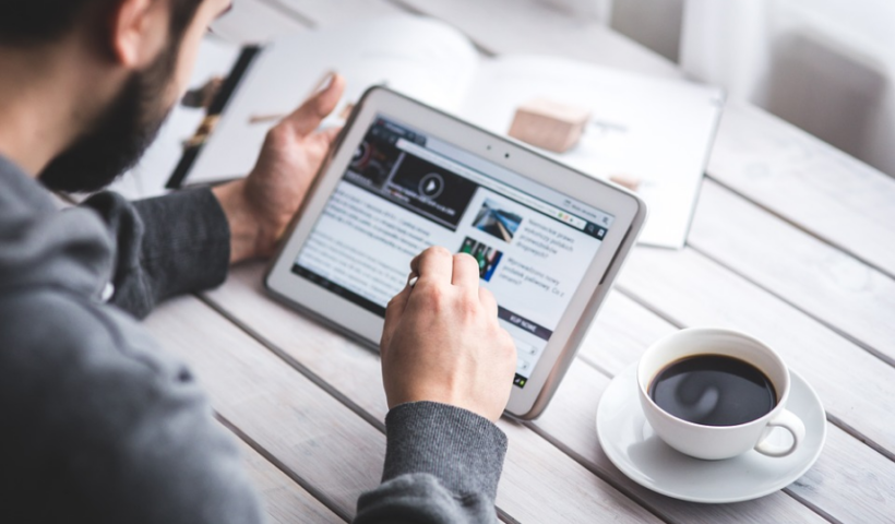 a person accessing online sites with an ipad