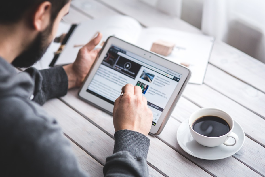 a person accessing online sites with an ipad